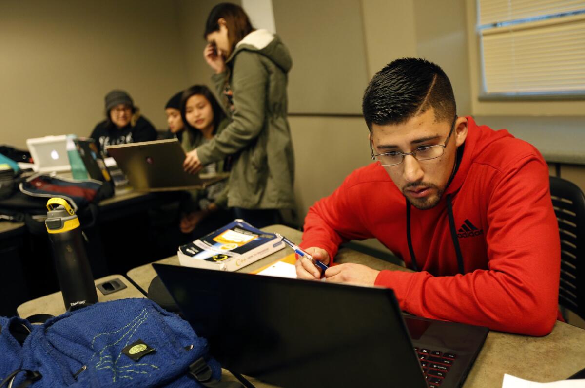 After classes, Dario Molina, 22, works on assignments during a study hall at Hartnell College Alisal Campus in Salinas, Calif.