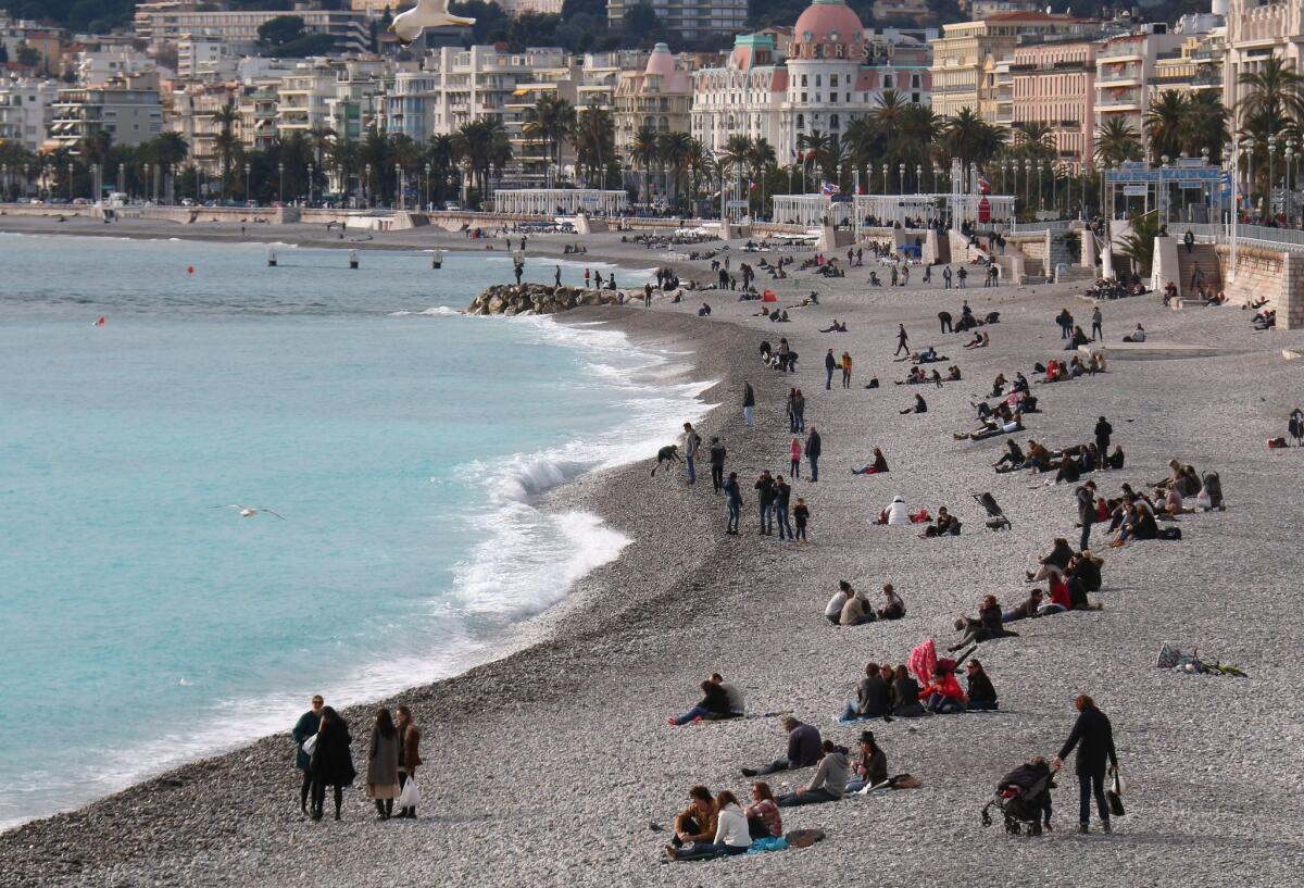 People sunbathe on the beach of Nice, southeastern France, on Jan. 24. A 16-year-old who flew alone to Turkey was from Nice.
