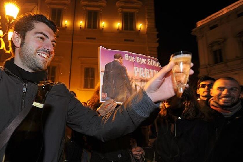 Protesters in Rome celebrate with sparkling wine in front of the Quirinale, the presidential palace, after Italian Prime Minister Silvio Berlusconi resigned Nov. 12, 2011. The 75-year-old billionaire, Italys longest-serving postwar prime minister, tendered his resignation Saturday night a few hours after the Parliament completed approval of a package of austerity measures demanded by the European Union.
