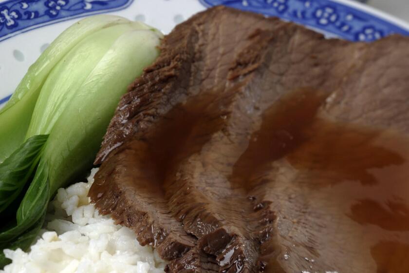 106563.FO.0118.brisket1.GMF-Chinese brisket is served with rice and bok choy in celebration of the Chinese New Year..(Gina Ferazzi/Los Angeles Times)