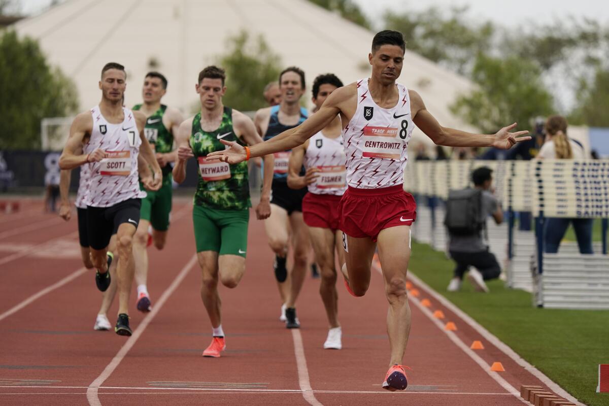 Matt Centrowitz crosses the finish line with arms outstretched in a 1,500-meter race at a Sound Running meet in 2021.
