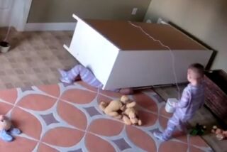 A video uploaded by Kayli Shoff shows a toddler help his twin brother come out from under a dresser that toppled on top of him.