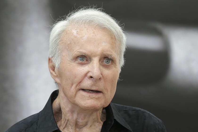 FILE - In this June 12, 2013, file photo, actor Robert Conrad of TV series "The Wild Wild West" poses for photographers during the 2013 Monte Carlo Television Festival, in Monaco. Conrad, the rugged, contentious actor who starred in the hugely popular 1960s television series "Hawaiian Eye" and "The Wild, Wild West," has died at age 84. A family spokesperson says the actor died Saturday morning, Feb. 8, 2020, in Malibu, Calif., from heart failure. (AP Photo/Lionel Cironneau, File)
