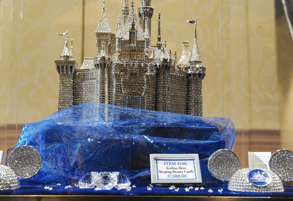 A crystal miniature of Sleeping Beauty Castle that costs $37,500 is one of the souvenirs of Disneyland’s 60th anniversary.