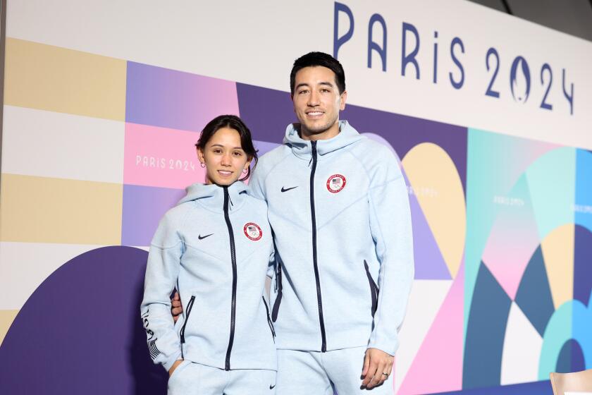 PARIS, FRANCE July 24, 2024-Married U. S. fencers Lee Kiefer and Gerek Meinhardt answer questions.