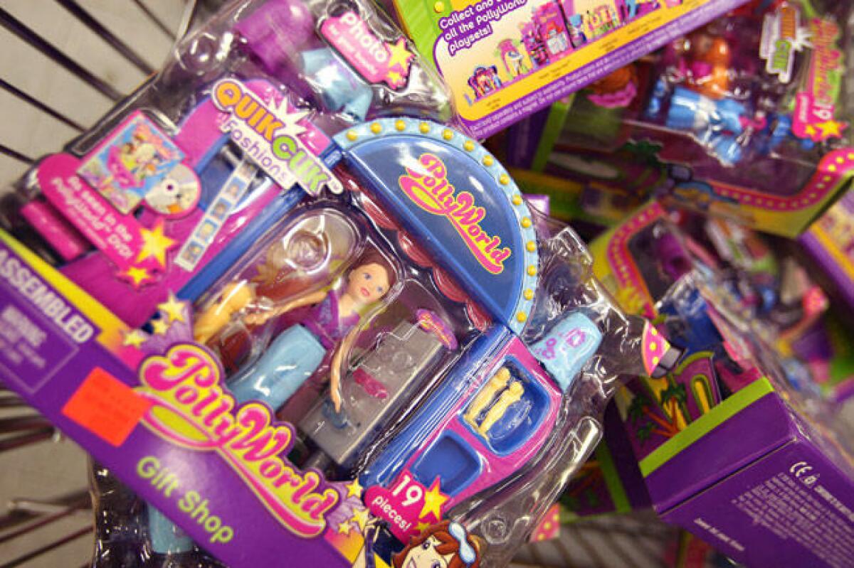 Recalled toys are piled in a shopping cart after being pulled from the shelves at the Cut Rate Toys store August 14, 2007 in Chicago, Ill.