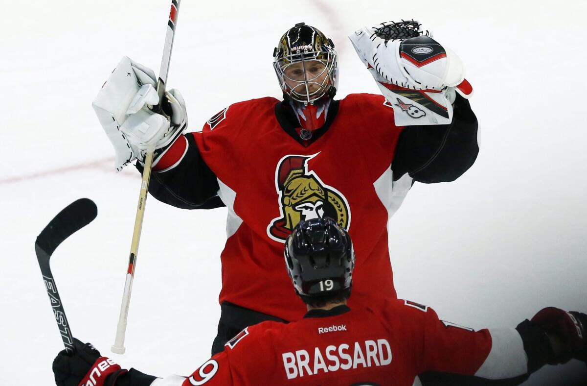 Senators goalie Craig Anderson (41) celebrates with teammate Derick Brassard (19) after Ottawa defeated the Montreal Canadiens, 4-3, in a shootout on Oct. 15.