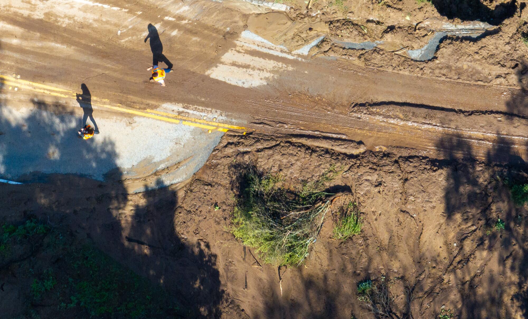 An aerial view of road damaged by mud flows. 