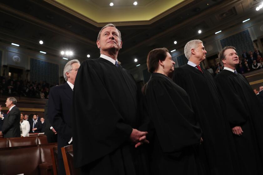 WASHINGTON, DC - FEBRUARY 04: (L-R) U.S. Supreme Court Chief Justice John Roberts and Associate Justices Elena Kagan, Neil Gorsuch and Brett Kavanaugh await the arrival to hear President Donald Trump deliver the State of the Union address in the House chamber on February 4, 2020 in Washington, DC. Trump is delivering his third State of the Union address on the night before the U.S. Senate is set to vote in his impeachment trial. (Photo by Leah Millis-Pool/Getty Images)