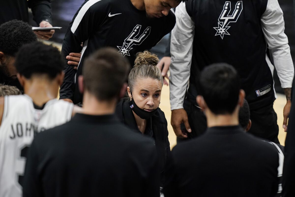 San Antonio Spurs assistant coach Becky Hammon, acting as head coach, calls a play during a timeout against the Lakers.