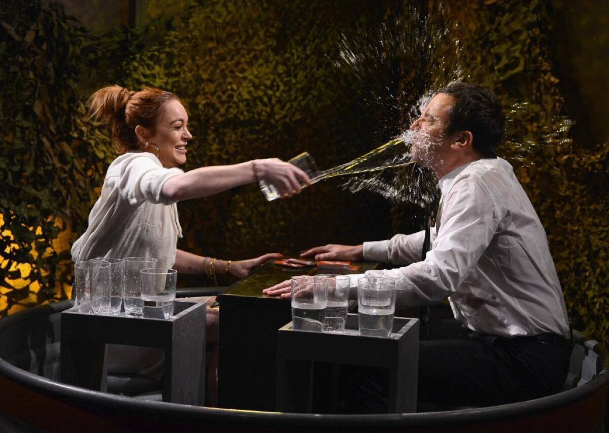 Jimmy Fallon (here with Lindsay Lohan) has made a splash as "Tonight Show" host.