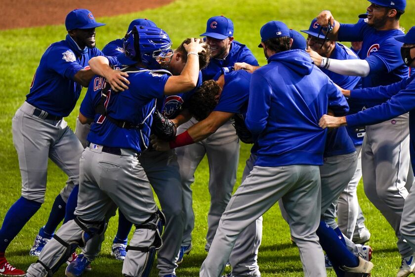 Chicago Cubs starting pitcher Alec Mills is swarmed by teammates after throwing a no hitter.