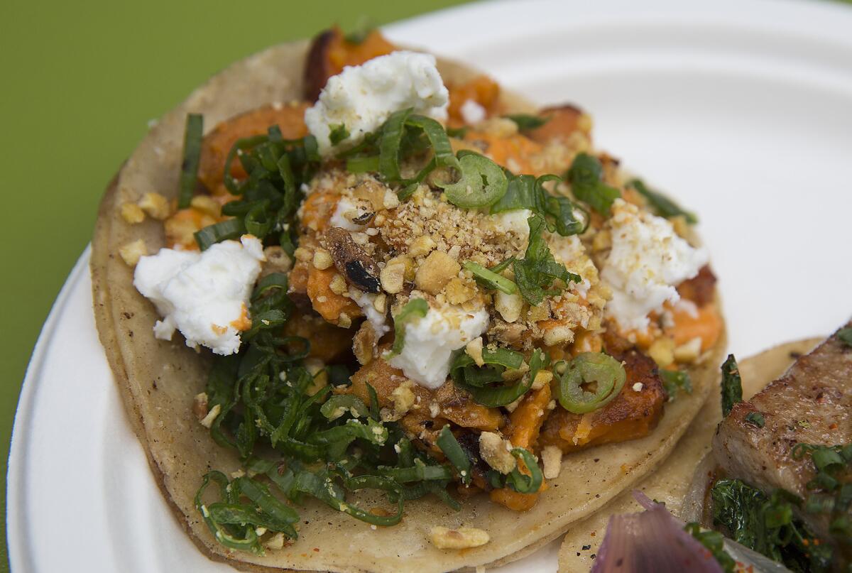 Guerrilla Tacos' sweet potato taco with almond chile, feta cheese, fried corn and scallions. This vegetarian taco is a signature of the roving truck's chef, Wes Avila.