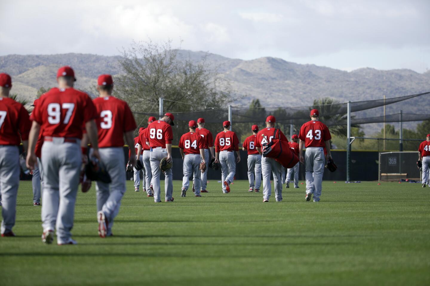 Players in Tempe make their way to a spring training workout on Feb. 23.