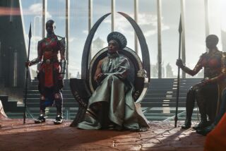 A woman sitting on a futuristic throne surrounded by other woman holding spears