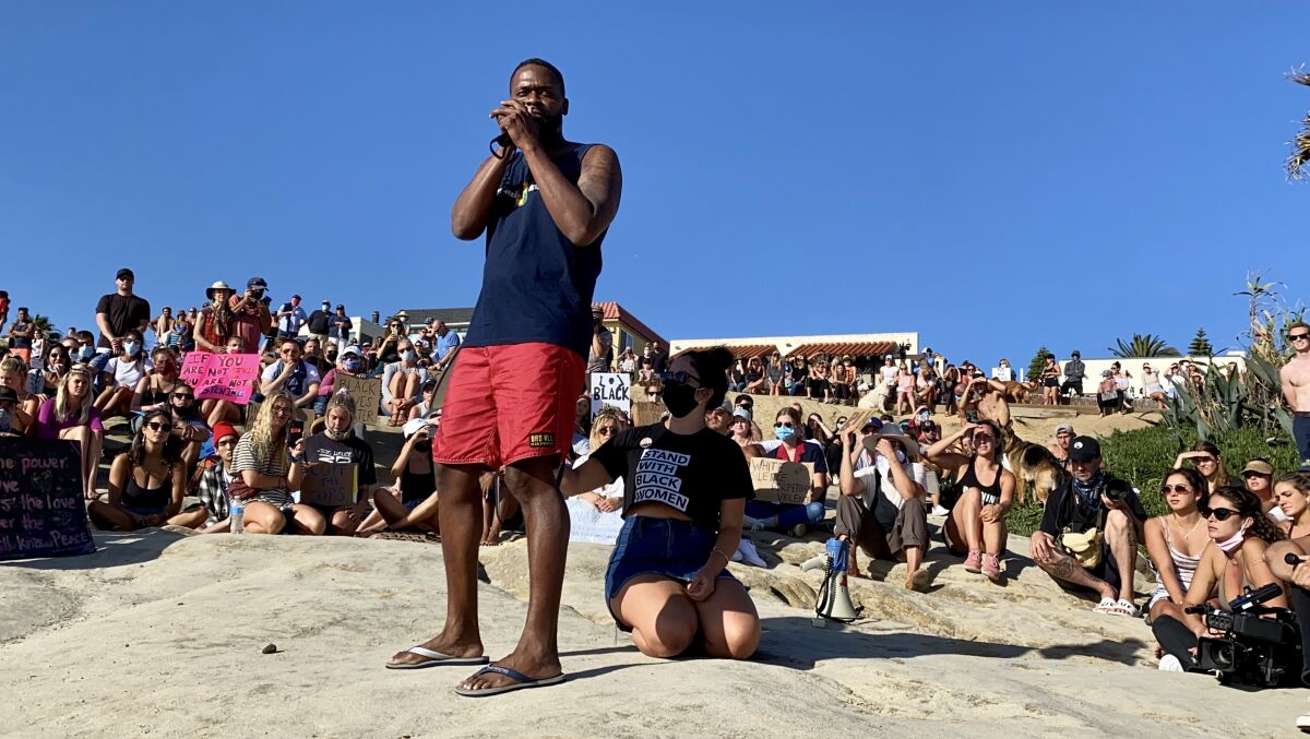 Local attorney and activist Dante Pride addresses protesters at Windansea Beach on June 8.