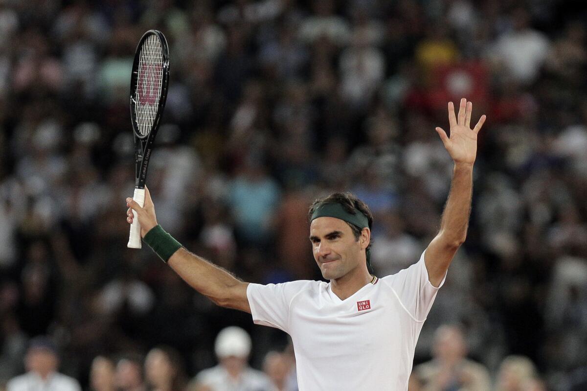 FILE - In this file photo dated Friday Feb. 7, 2020, Roger Federer thanks the crowd after winning 3 sets to 2 against Rafael Nadal in their exhibition tennis match held at the Cape Town Stadium in Cape Town, South Africa. The 20-time Grand Slam champion Roger Federer will face the winner of the match between Jeremy Chardy and Dan Evans in the Qatar Open next week in his first competition for more than a year. (AP Photo/Halden Krog, FILE)