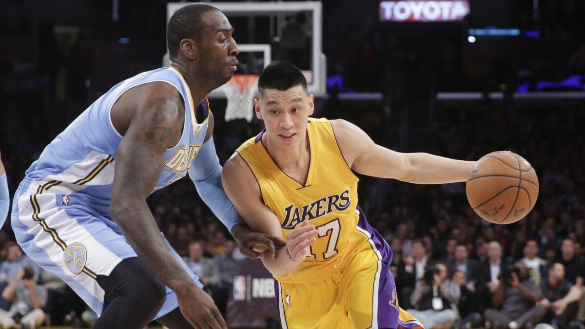 Lakers guard Jeremy Lin, right, tries to drive past Denver Nuggets forward J.J. Hickson during the first half of the Lakers' 106-96 loss on Feb. 10.