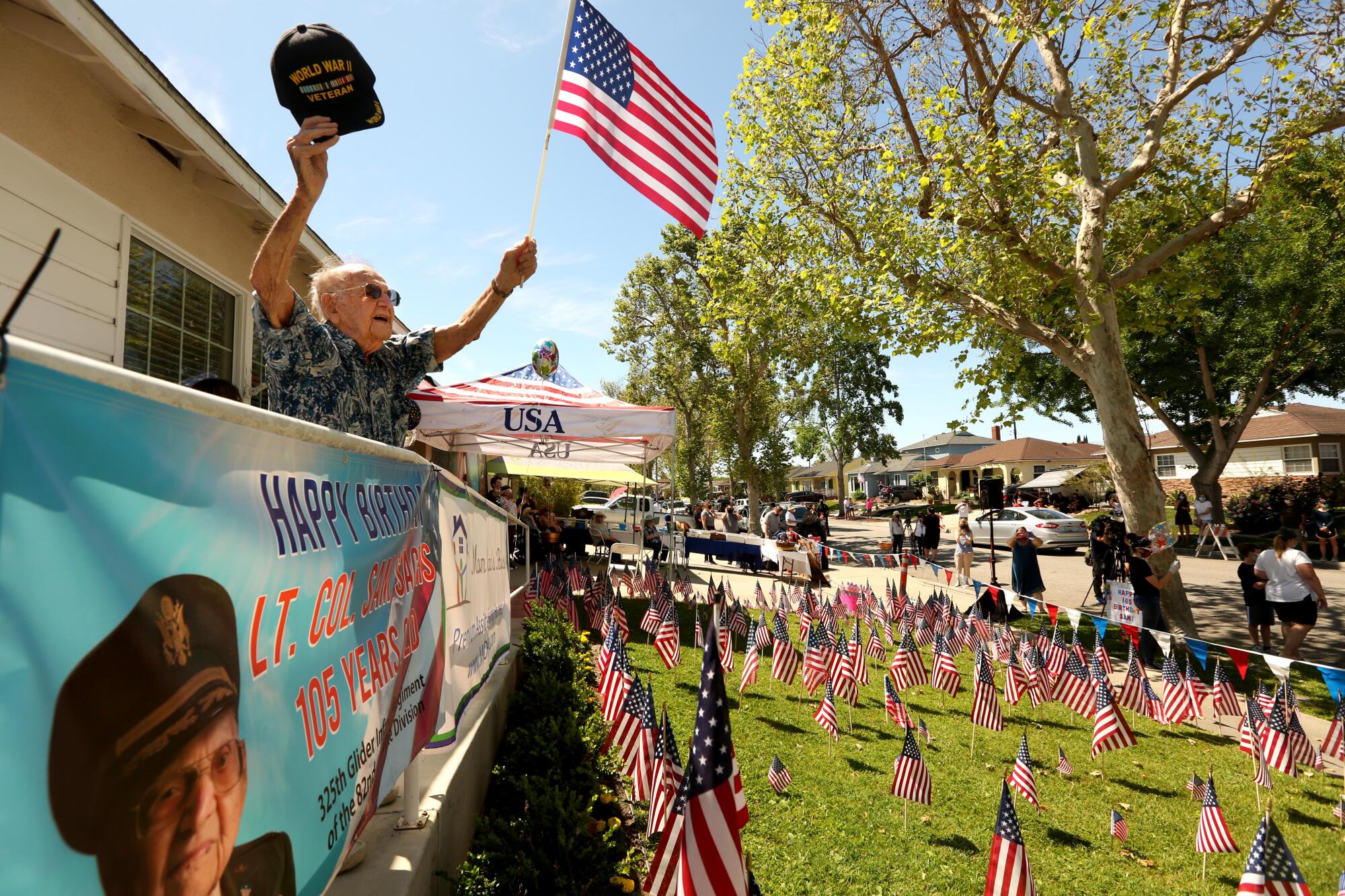 Lt. Col. Sam Sachs, a World War II veteran, cheers well-wishers during a celebration of his 105th birthday.