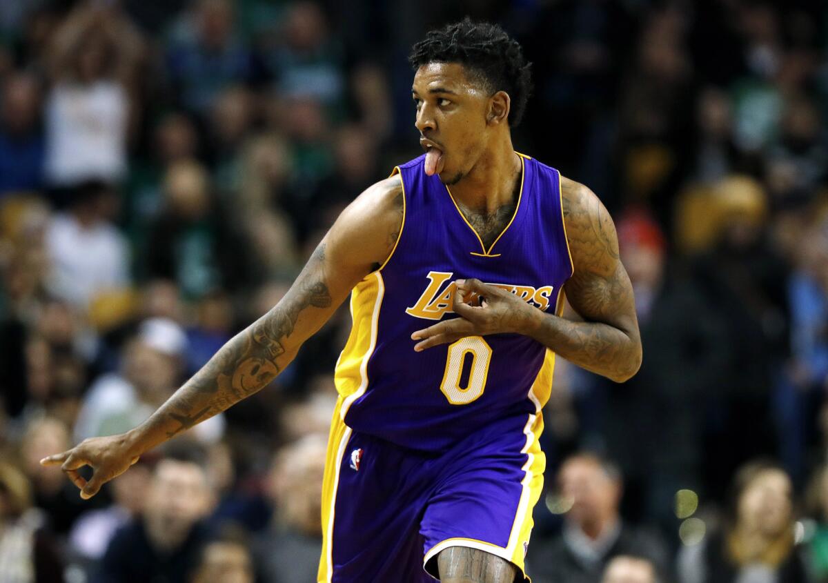 Los Angeles Lakers guard Nick Young celebrates after a three point basket against the Boston Celtics during the second quarter of an NBA basketball game in Boston Friday, Feb. 3, 2017. (AP Photo/Winslow Townson)