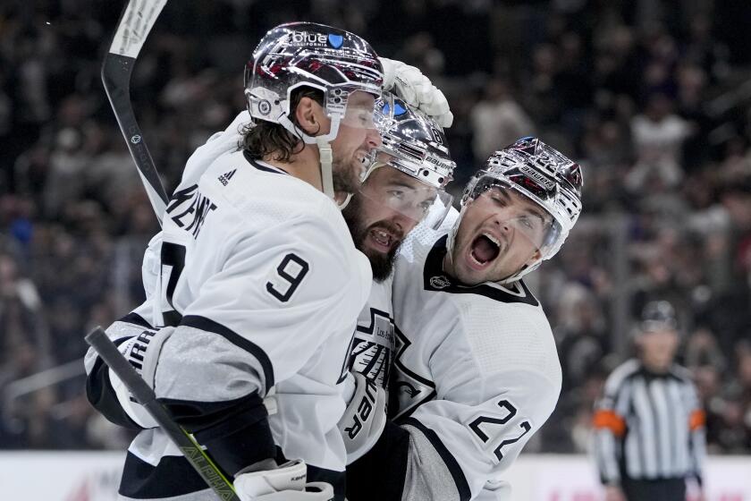 Los Angeles Kings defenseman Drew Doughty, center, celebrates his goal against the Anaheim Ducks.