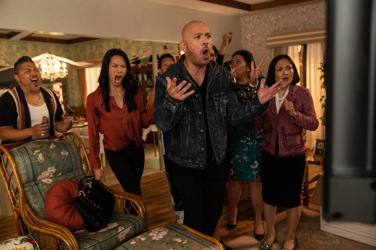 A Filipino-American family gathered for a holiday shouts at the TV in the comedy "Easter Sunday."