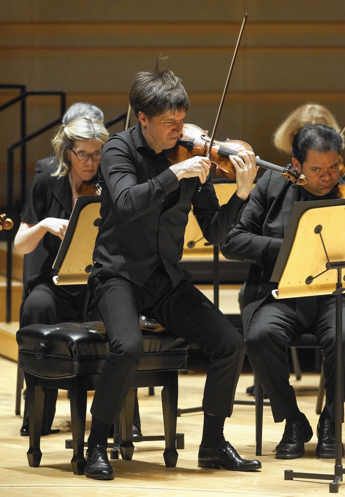 Violinist and conductor Joshua Bell performs Prokofiev's Symphony No. 1 during the Academy of St. Martin in the Fields concert at the Renee and Henry Segerstrom Concert Hall in Costa Mesa on Monday.