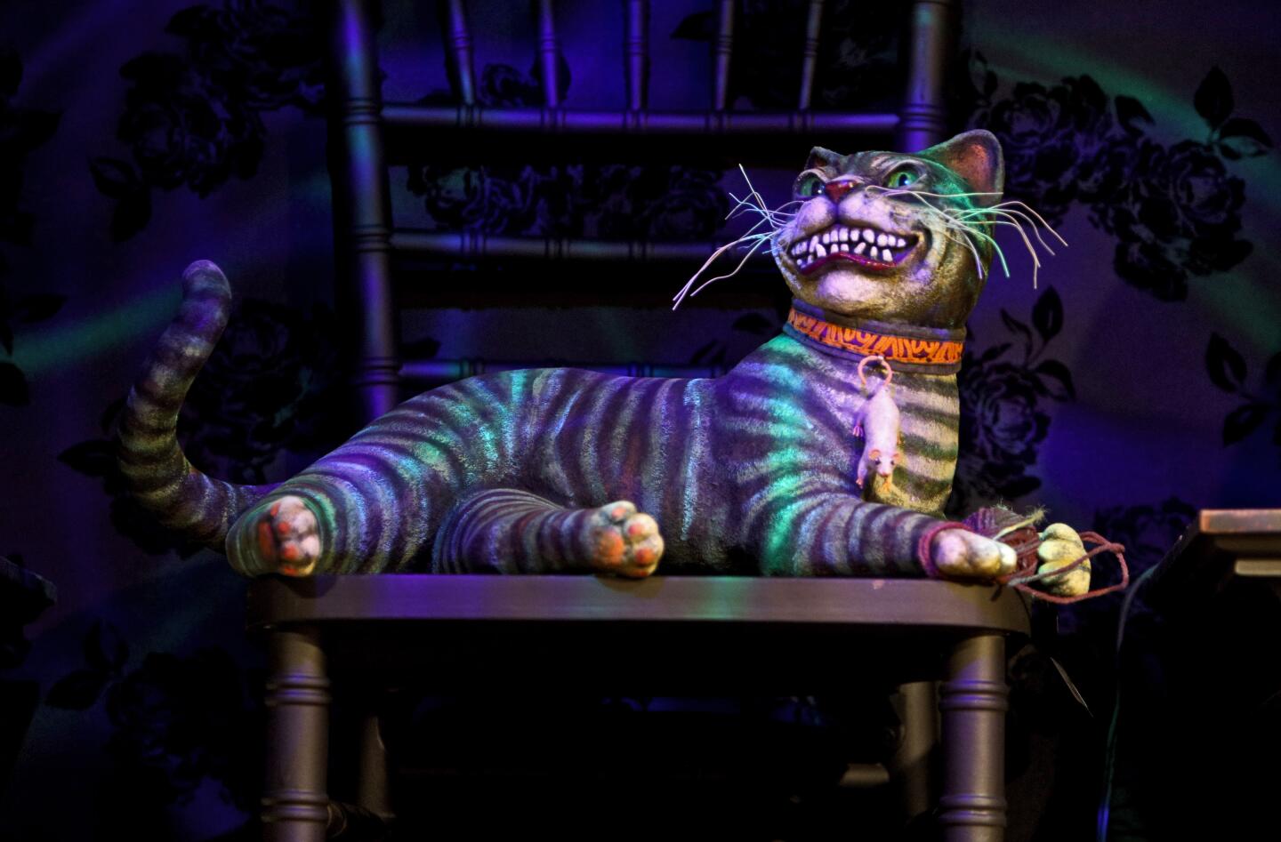The Cheshire Cat greets visitors to "Malice in Wonderland," the Halloween boutique at Roger's Gardens in Corona del Mar.