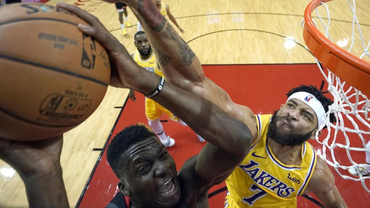Lakers center JaVale McGee attempts to block a shot by Rockets center Clint Capela during a game earlier this month.