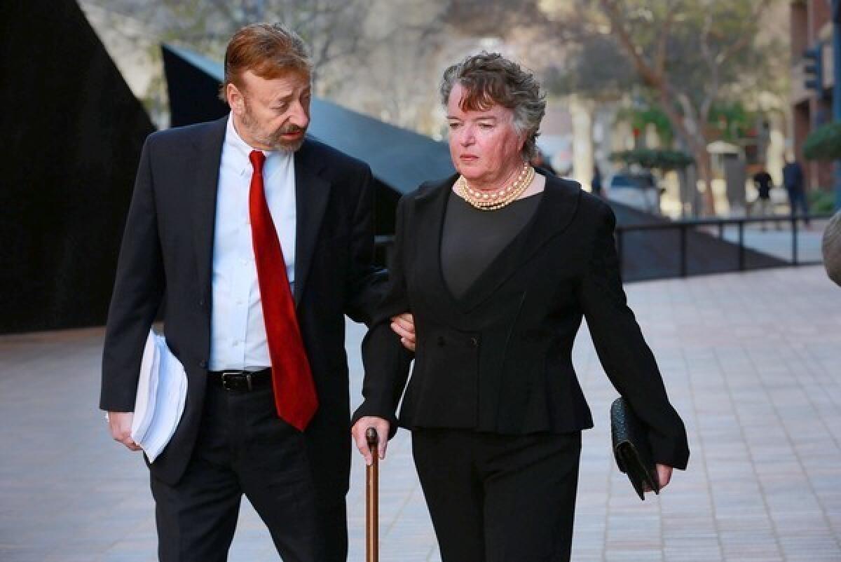 Maureen O'Connor walks to court with her attorney, Eugene Iredale. If O'Connor violates no further laws and makes restitution, the charge of making illegal financial transactions may be dismissed.