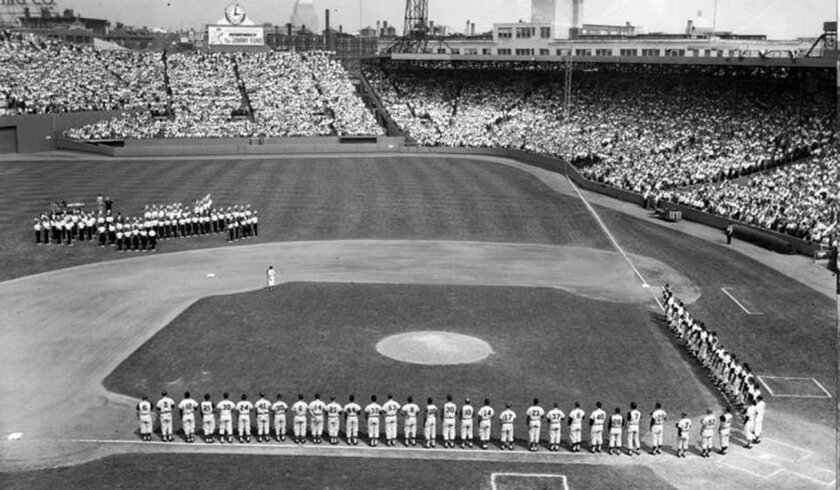 Players and coaches line up for the national anthem before the 1961 All-Star Game played at Fenway Park.