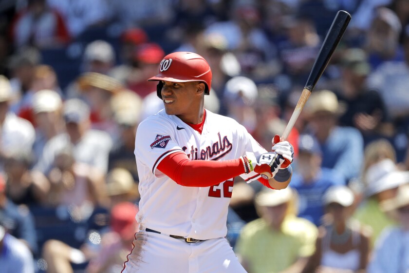 FILE - In this March 12, 2020, file photo, Washington Nationals' Juan Soto waits for a pitch from the New York Yankees during the fourth inning of a spring training baseball game, in West Palm Beach, Fla. Baseball begins Thursday, July 23, 2020, with the New York Yankees at Washington Nationals. Juan Soto and Washington open their title defense after winning the World Series for the first time in franchise history. Gerrit Cole is hoping to lead New York to its 28th championship after the ace right-hander signed a blockbuster deal with the Yankees in free agency. (AP Photo/Julio Cortez, File)