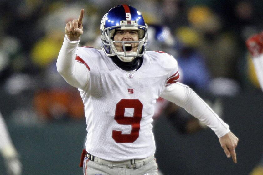 Giants kicker Lawrence Tynes celebrates after kicking a field goal in overtime of a 23-20 victory over the Green Bay Packers in the 2008 NFC Championship game.