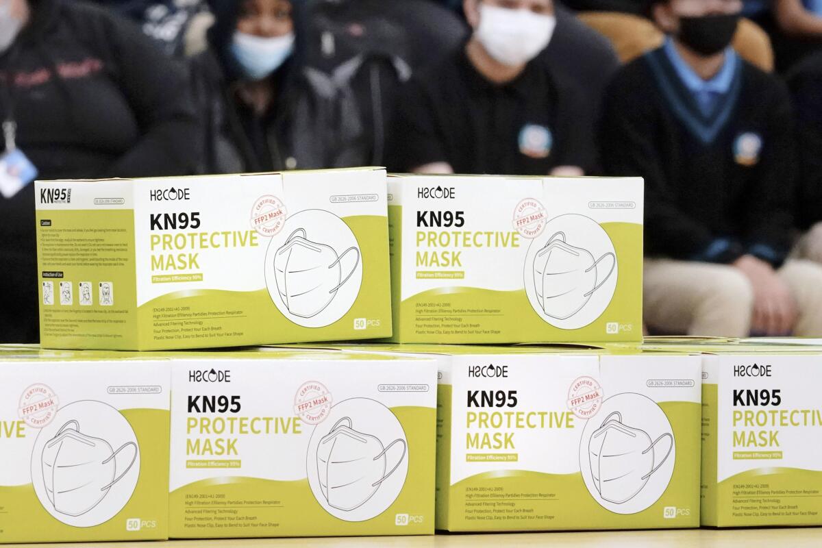 Boxes of KN95 protective masks are stacked together.