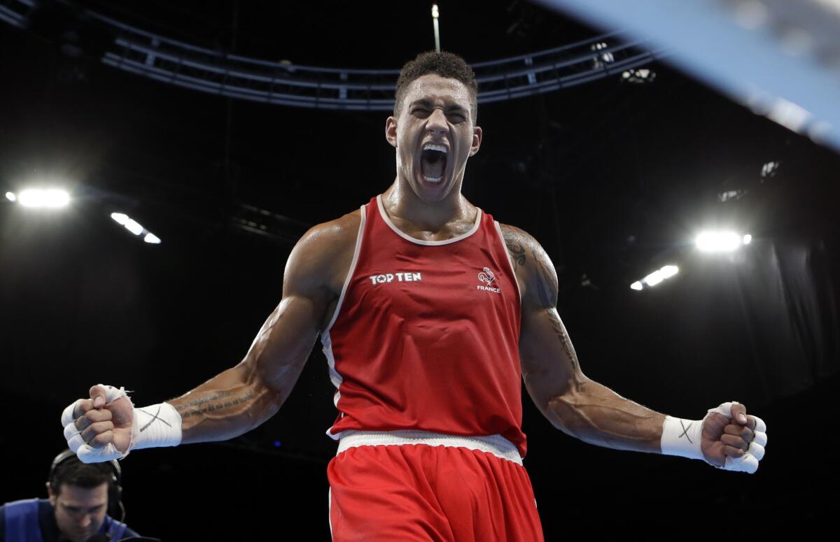 France's Tony Yoka celebrates after winning Olympic gold on Aug. 21.