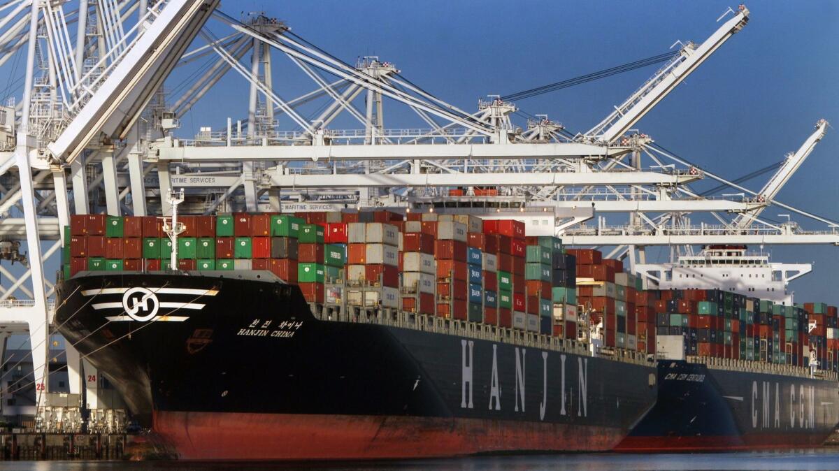 Container ships being loaded at the Port of Long Beach. (Bob Chamberlin / Los Angeles Times)