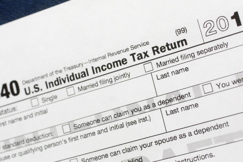 FILE - This July 24, 2018, file photo shows a portion of the 1040 U.S. Individual Income Tax Return form for 2018 in New York. Its the first year that taxpayers will be filing under the massive tax law overhaul pushed through by the Trump administration. (AP Photo/Mark Lennihan, File)