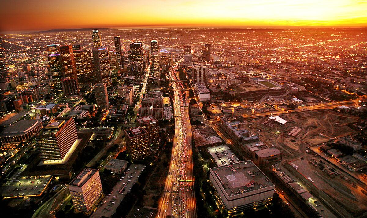 A view of the 110 Freeway slicing through downtown Los Angeles. How would you describe California in one word?