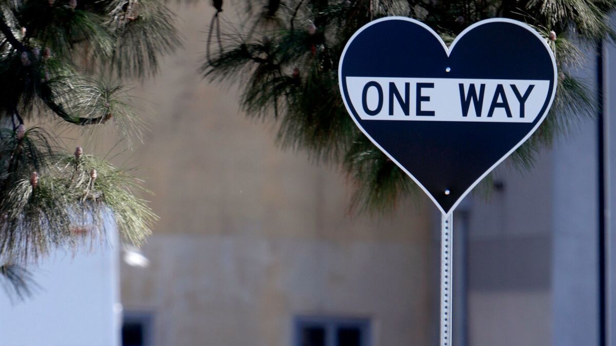 A one-way street sign art piece comes in the shape of a heart. It was recently installed by artist Scott Froschauer at Pacific Park in Glendale on Nov. 7.
