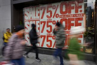 Shoppers pass a window displaying a sale sign on Oxford Street in London, Wednesday, Dec. 20, 2023. Inflation in the U.K. as measured by the consumer prices index has eased back to its lowest level in more than two years. The Office for National Statistics said Wednesday that inflation dropped to 3.9% in the year to November, its lowest level since Sept. 2021, from 4.6% the previous month. (AP Photo/Kirsty Wigglesworth)