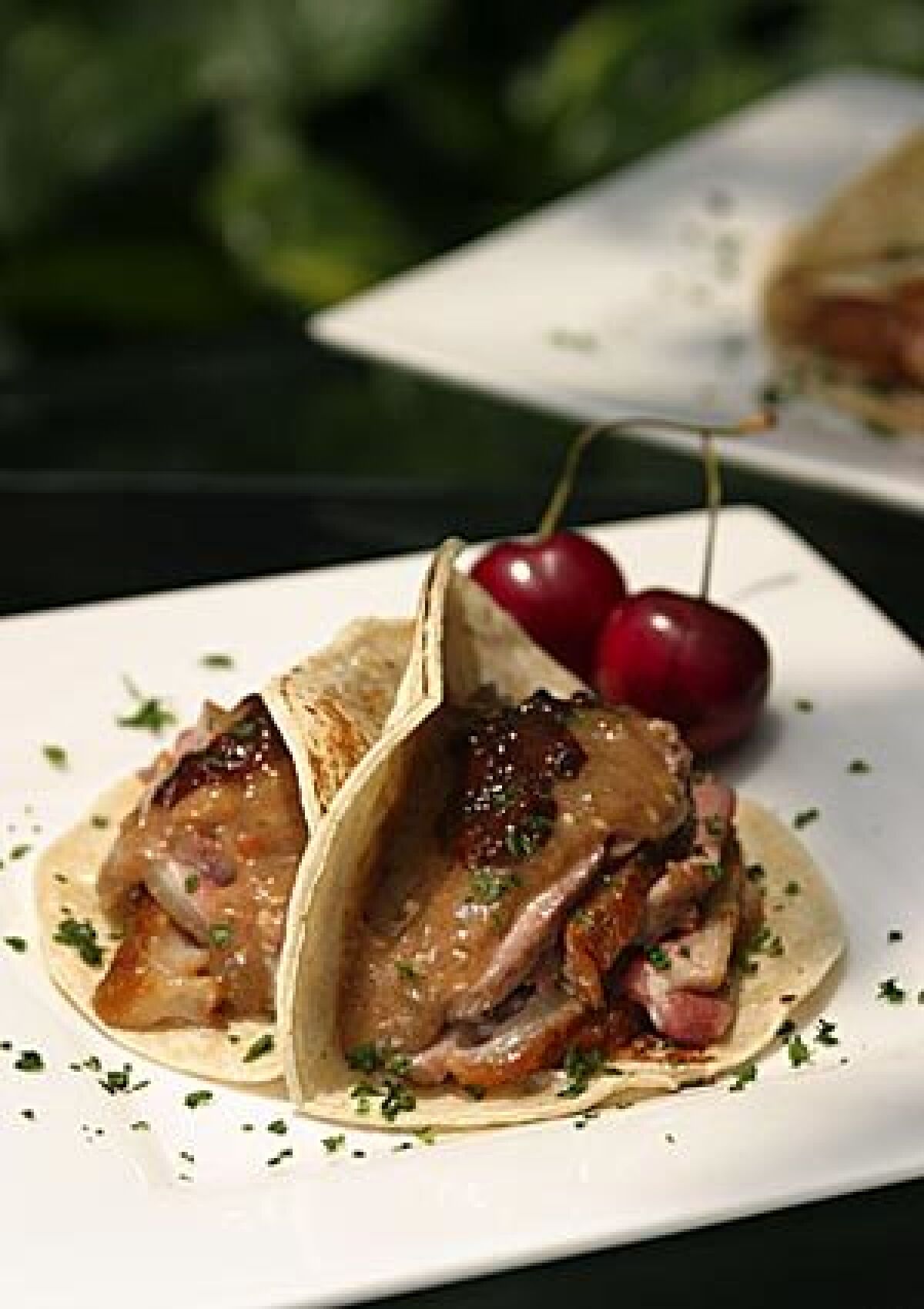 Duck tacos with a cherry compote.