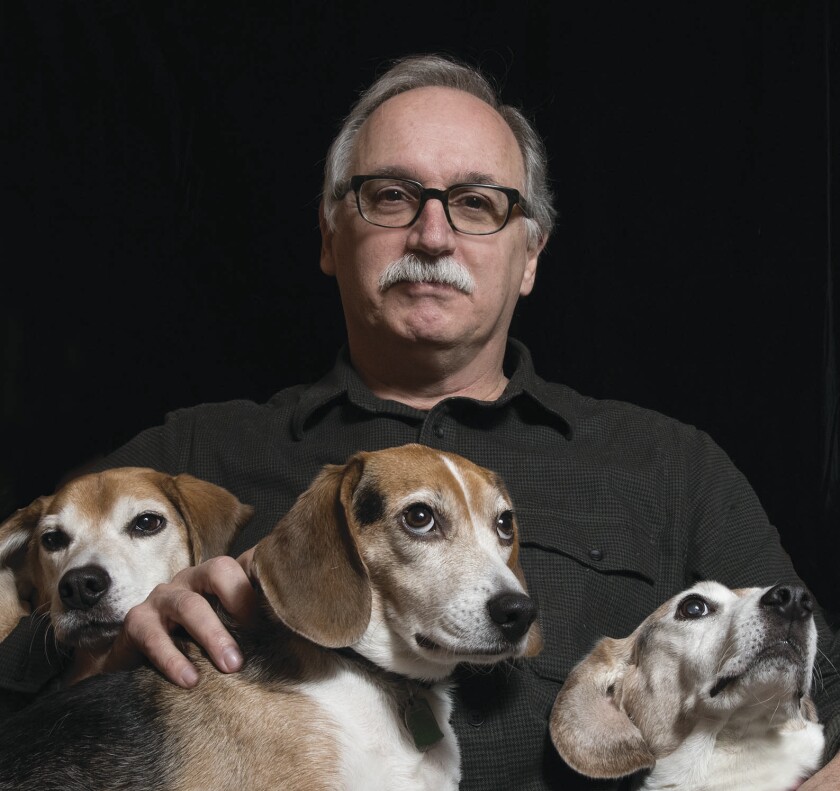 Author Jim Shepard with three beagles.