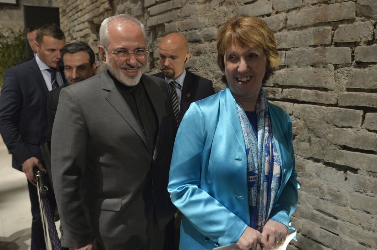 Catherine Ashton, the European Union foreign policy chief, and Iranian Foreign Minister Mohammad Javad Zarif leave a press briefing July 18 in Vienna.