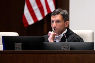 Denise District Judge K. Christopher Jayaram follows arguments from attorneys as they argue over a new state law on how providers dispense abortion medications in Johnson County District Court, Tuesday, Aug. 8, 2023, in Olathe, Kan. (AP Photo/John Hanna)