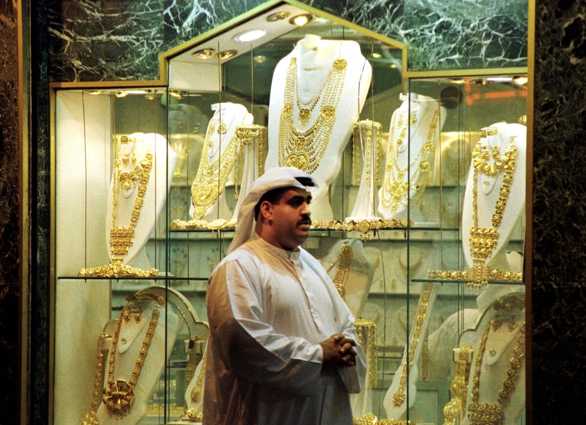 A man passes a Dubai shop displaying gold wedding jewelry. More than half of the citizens of the United Arab Emirates are overweight or obese, the World Health Organization reports.