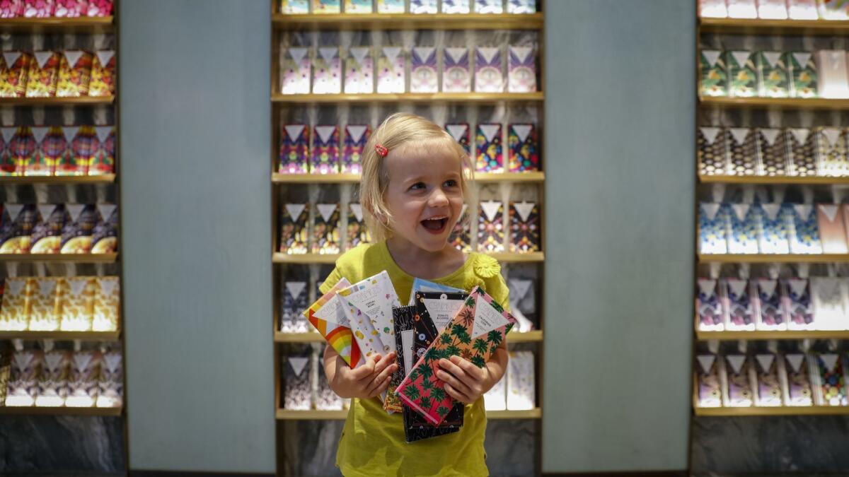 Ellie McNayr, 5, shows off her selection of chocolate at Compartes at Westfield Century City.