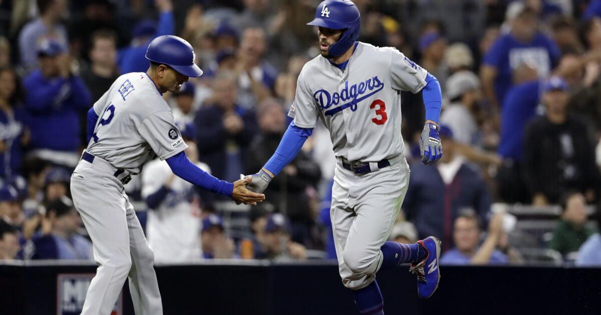 July 19, 2019: Los Angeles Dodgers manager Dave Roberts (30) and Los  Angeles Dodgers third base coach Dino Ebel (12) pose for a photo before the  game between the Miami Marlins and