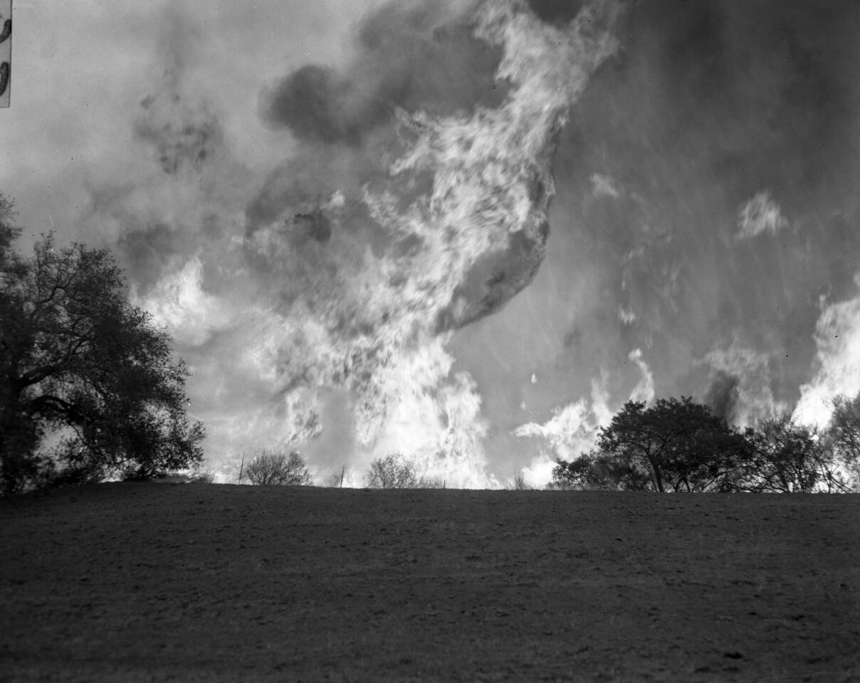 1961 photo shows flames shooting over a ridge