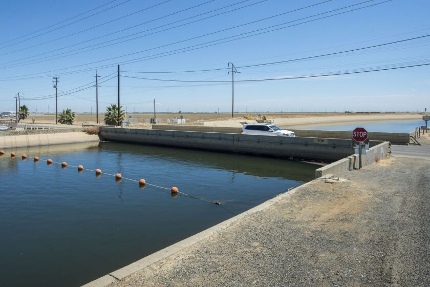 The Russell Avenue bridge in Firebaugh, Calif., has sunk so much it is almost touching the surface of the water in the Delta-Mendota Canal.