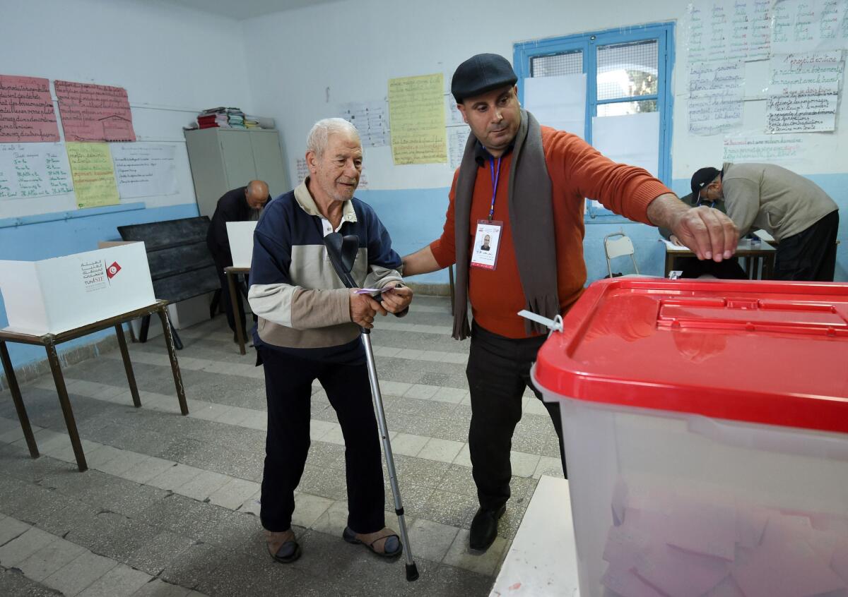 A man casts his vote Sunday at a polling station in Tunis, Tunisia.